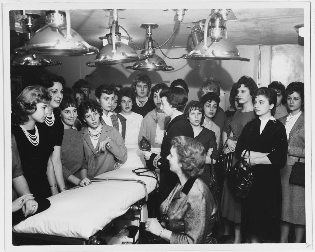 Thirty members of the Future Nurses Club visiting the USNS General Maurice Rose’s operating room.